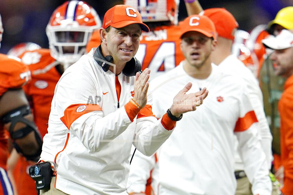 David J. Phillip FILE - In this Jan. 13, 2020, file photo, Clemson head coach Dabo Swinney celebrates after his team scored during the second half of a NCAA College Football Playoff national championship game against LSU in New Orleans. The Tigers have locked up the best recruiting class of the Dabo Swinney era, which already includes two national titles and five playoff appearances. (AP Photo/David J. Phillip, File)
