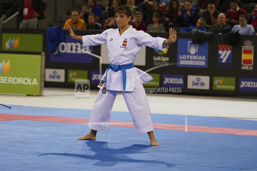 In this photo provided by the Spanish karate federation, Spanish karate athlete Sandra Sanchez takes part in a Senior Female Kata - Final bout in Madrid, Spain on Dec. 1, 2019. Personal determination has taken Sanchez to the top of the world rankings, and in a few months from now the 38-year old will reach the biggest moment of her career by competing in the inaugural Olympic karate tournament at the upcoming summer Tokyo Olympic Games. (Xavier Servolle/Kphotos Via AP)