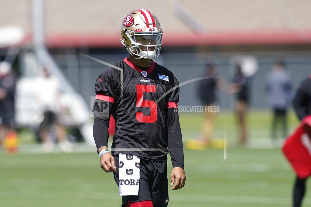 Jeff Chiu San Francisco 49ers quarterback Trey Lance (5) smiles while taking part in drills at the NFL football team's practice facility in Santa Clara, Calif., Tuesday, June 7, 2022. (AP Photo/Jeff Chiu)