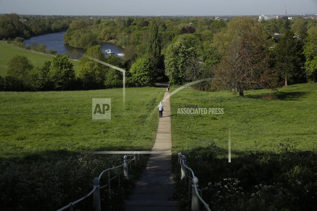 Matt Dunham A person walks on a path towards the River Thames in Richmond, London, during the lockdown for the coronavirus, Tuesday, April 21, 2020. The highly contagious COVID-19 coronavirus has impacted on nations around the globe, many imposing self isolation and exercising social distancing when people move from their homes. (AP Photo/Matt Dunham)