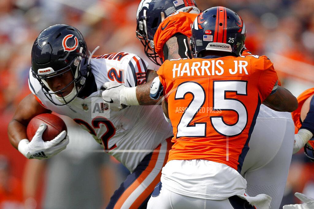David Zalubowski Chicago Bears running back David Montgomery (32) is hit by DUPLICATE***Denver Broncos running back Theo Riddick (25)***Denver Broncos cornerback Chris Harris (25) during the first half of an NFL football game, Sunday, Sept. 15, 2019, in Denver. (AP Photo/David Zalubowski)