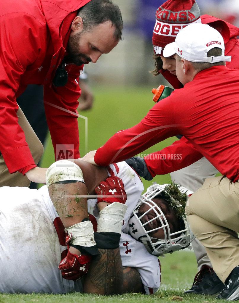 Nam Y. Huh Wisconsin north tackle Olive Sagapolu is helped after an injury during the second half of an NCAA college football game against Northwestern in Evanston, Ill., Saturday, Oct. 27, 2018. Northwestern won 31-17. (AP Photo/Nam Y. Huh)