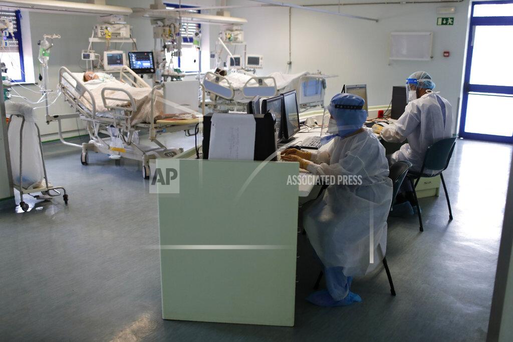 Armando Franca Doctors work at computers in a COVID-19 Intensive Care Unit at the Curry Cabral hospital in Lisbon, Thursday, Feb. 11, 2021. After Portugal figured for about two weeks last month as the world’s worst-hit country by size of population, anxiety over the recent pandemic peak has eased slightly. The number of COVID-19 patients in hospital and in intensive care fell Thursday for the third straight day. The health ministry reported the fewest hospitalizations since Jan. 20 and the fewest patients in ICUs for almost two weeks. (AP Photo/Armando Franca)