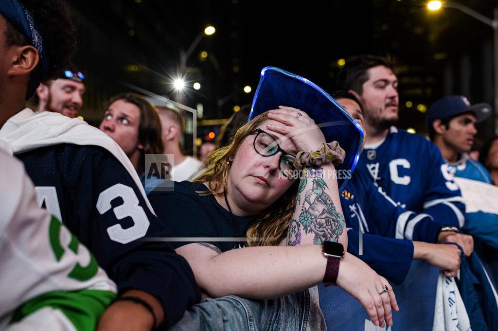 Christopher Katsarov Fans react during Game 7 of an NHL hockey first-round playoff series between the Toronto Maple Leafs and the Tampa Bay Lightning in Toronto, Saturday May 14, 2022. (Christopher Katsarov/The Canadian Press via AP)