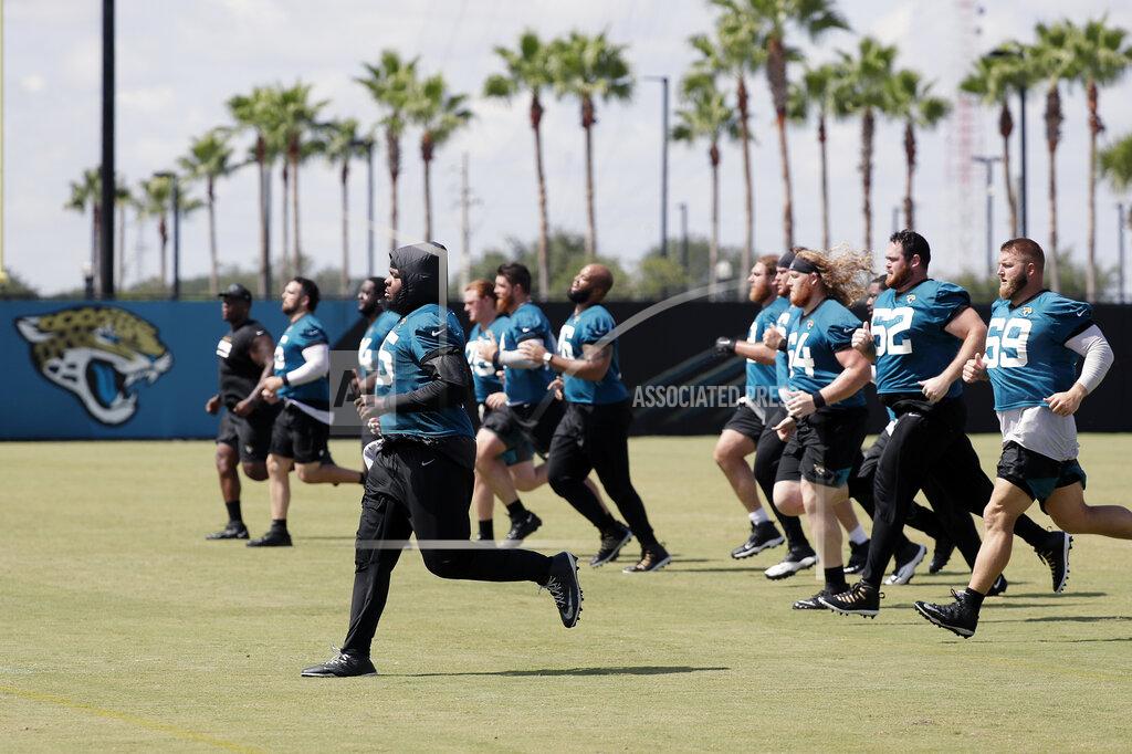 John Raoux Jacksonville Jaguars players run sprints during an NFL football workout, Thursday, Aug. 13, 2020, in Jacksonville, Fla. (AP Photo/John Raoux)