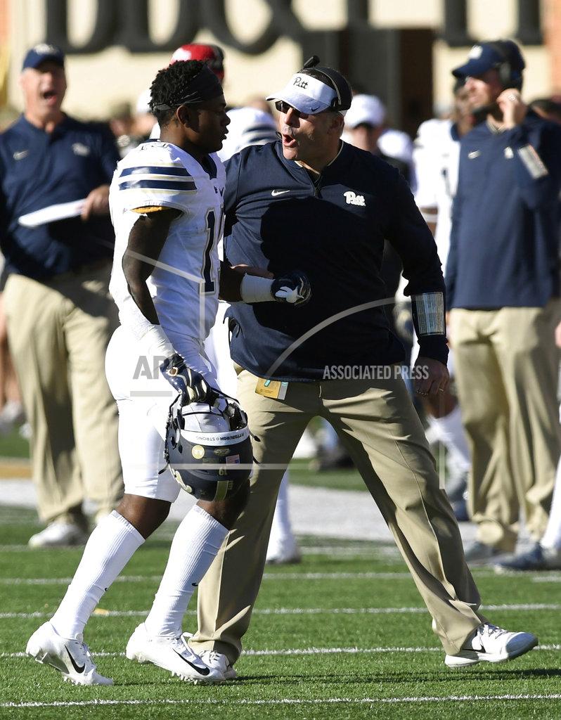 Woody Marshall Pittsburgh's V'Lique Carter (19) gets encouragement from head coach Pat Narduzzi as he goes to the sideline during the second half of their NCAA college football game against Wake Forest on Saturday, Nov. 17, 2018, in Winston-Salem, N.C. (AP Photo/Woody Marshall)
