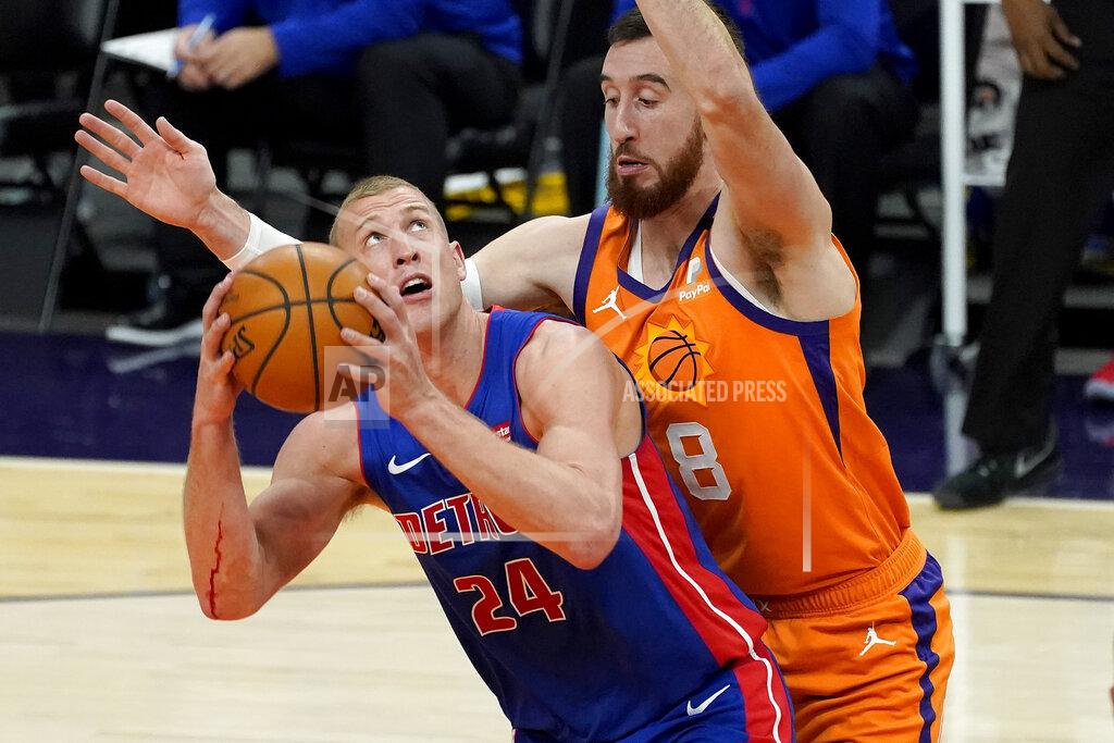 Matt York Detroit Pistons center Mason Plumlee (24) tries to shoot over Phoenix Suns forward Frank Kaminsky (8) during the first half of an NBA basketball game, Friday, Feb. 5, 2021, in Phoenix. (AP Photo/Matt York)