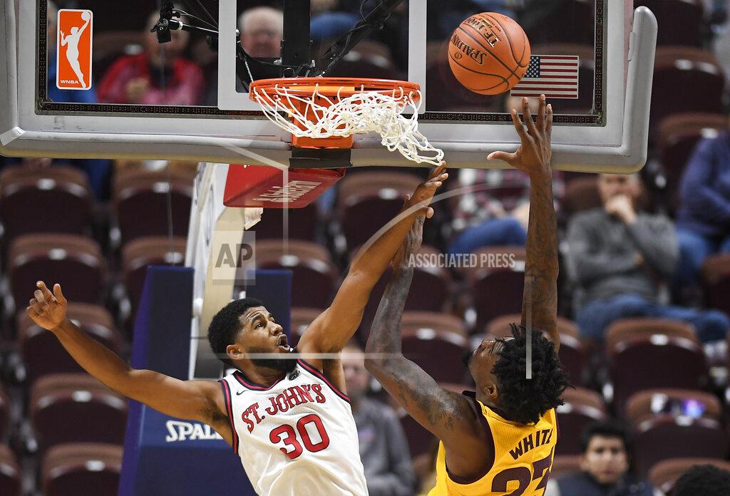 Jessica Hill St. John's LJ Figueroa fouls Arizona State's Romello White during the second half of an NCAA college basketball game, Saturday, Nov. 23, 2019, in Uncasville, Conn. (AP Photo/Jessica Hill)