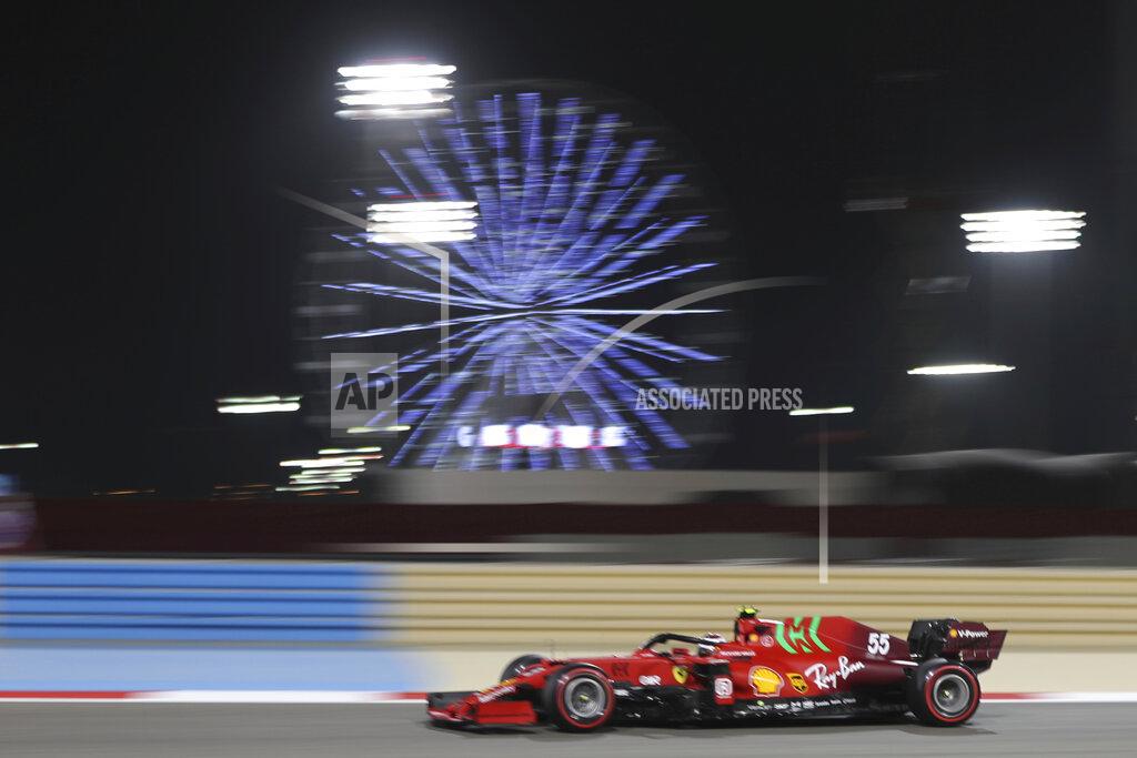 Kamran Jebreili Ferrari driver Carlos Sainz of Spain steers his car during the second free practice at the Formula One Bahrain International Circuit in Sakhir, Bahrain, Friday, March 26, 2021. The Bahrain Formula One Grand Prix will take place on Sunday. (AP Photo/Kamran Jebreili)