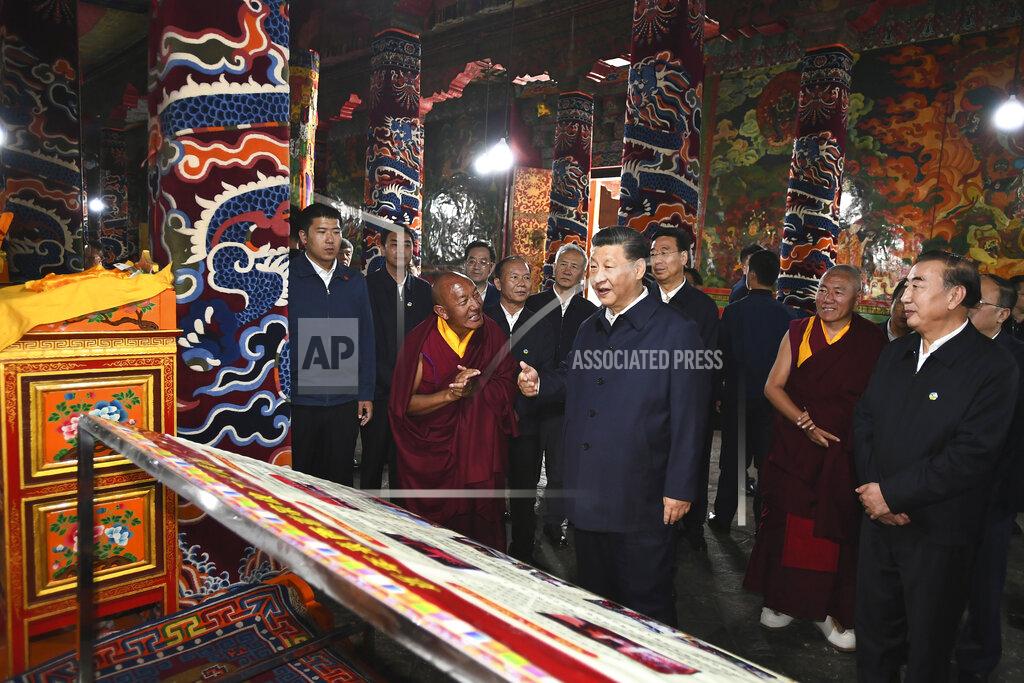 Xie Huanchi In this July 22, 2021 photo released by China's Xinhua News Agency, Chinese President Xi Jinping, center, visits the Drepung Monastery near Lhasa in western China's Tibet Autonomous Region. Chinese leader Xi Jinping has made a rare visit to Tibet as authorities tighten controls over the Himalayan region's traditional Buddhist culture, accompanied by an accelerated drive for economic development. (Xie Huanchi/Xinhua via AP)