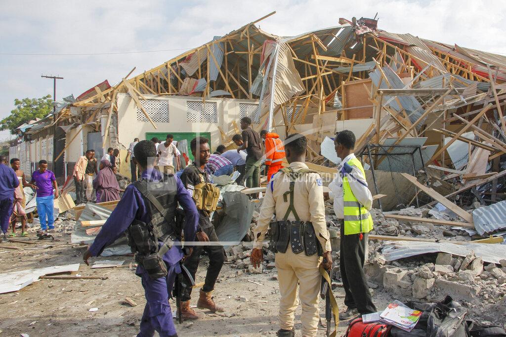 Farah Abdi Warsameh Security forces and rescue workers search for bodies at the scene of a blast in Mogadishu, Somalia Thursday, Nov. 25, 2021. Witnesses say a large explosion has occurred in a busy part of Somalia's capital during the morning rush hour. (AP Photo/Farah Abdi Warsameh)
