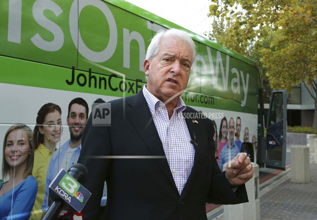 Rich Pedroncelli FILE - In this Nov. 1, 2018, file photo, Republican gubernatorial candidate John Cox talks to reporters before beginning a statewide bus tour in Sacramento, Calif. A fading coronavirus crisis and an astounding windfall of tax dollars have reshuffled California's emerging recall election, allowing Democratic Gov. Gavin Newsom to talk of a mask-free future and propose billions in new spending for schools and businesses as he looks to fend off Republicans who depict him as a foppish failure. (AP Photo/Rich Pedroncelli, File)