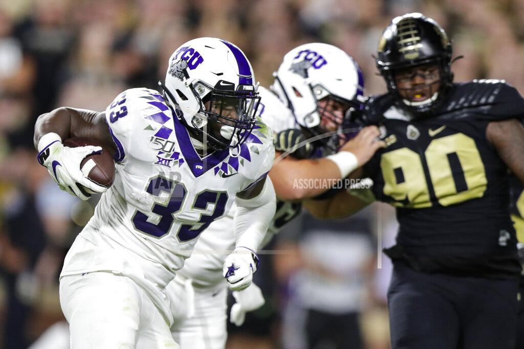 Michael Conroy TCU running back Sewo Olonilua (33) carries against Purdue during the second half of an NCAA college football game in West Lafayette, Ind., Saturday, Sept. 14, 2019. (AP Photo/Michael Conroy)