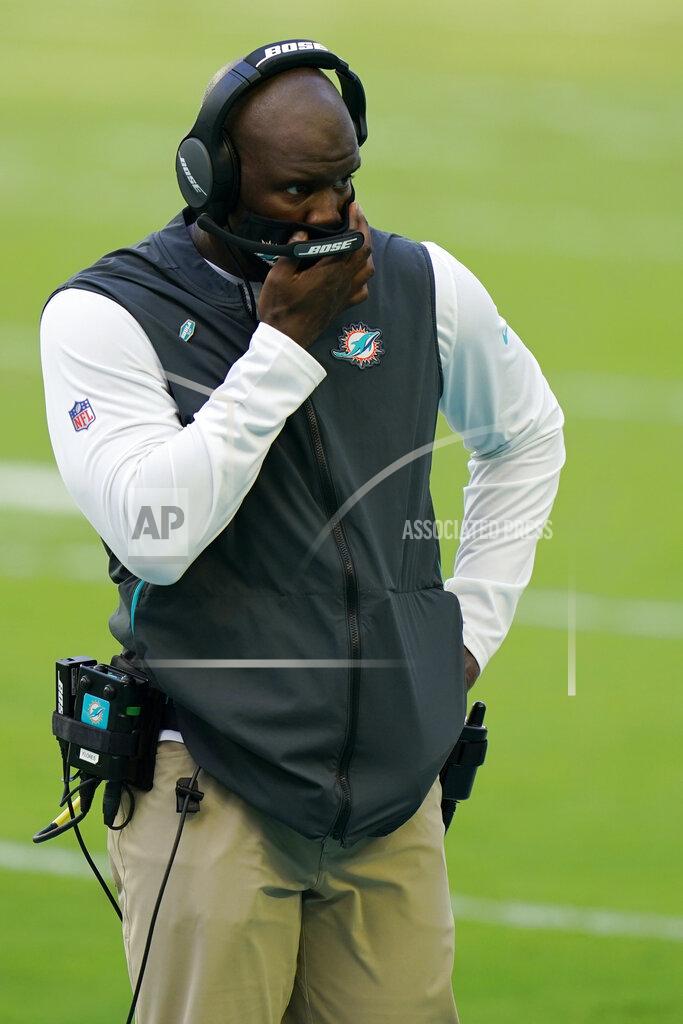 Wilfredo Lee Miami Dolphins head coach Brian Flores looks down field, during the second half of an NFL football game against the Buffalo Bills, Sunday, Sept. 20, 2020 in Miami Gardens, Fla. The Bills defeated the Dolphins 31-28. (AP Photo/Wilfredo Lee)