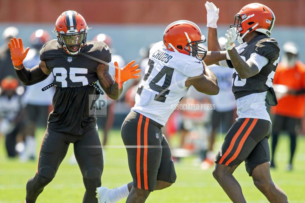 David Dermer Cleveland Browns running back Nick Chubb (24) runs the ball against defensive back Greedy Williams (26) during an NFL football practice in Berea, Ohio, Wednesday, Aug. 4, 2021. (AP Photo/David Dermer)