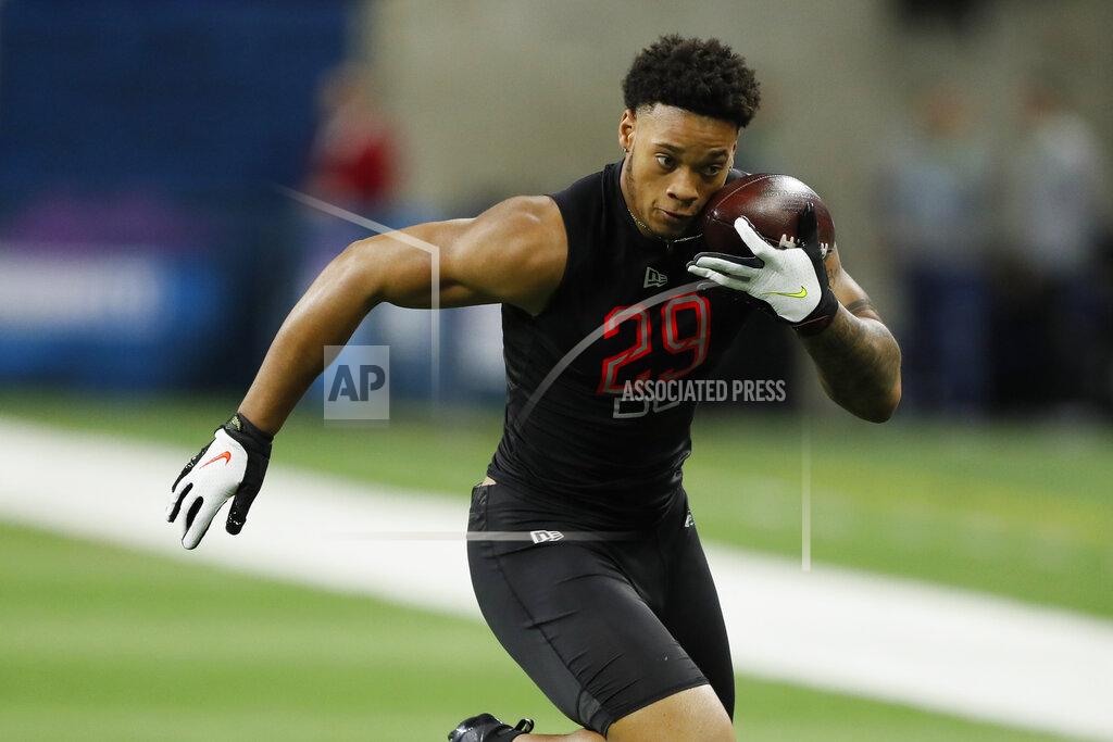 Charlie Neibergall In this Feb. 29, 2020, photo, Penn State defensive lineman Yetur Gross-Matos runs a drill at the NFL football scouting combine in Indianapolis. Gross-Matos would have liked to be in Las Vegas on Thursday, April 23, 2020, with other NFL draft prospects, but the Penn State defensive lineman is just as comfortable watching it at home. (AP Photo/Charlie Neibergall)