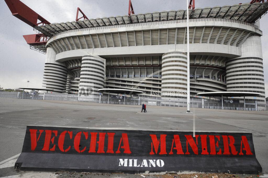 Luca Bruno A banner in the colours of AC Milan and reading in Italian "Old style" is displayed outside the San Siro stadium in Milan, Italy, Monday, April 19, 2021. AC Milan, along with Juventus and Inter Milan, are the three Italian clubs that entered as founding members in the European Super League. The Super League intends to launch a 20-team competition with 15 founding members but only 12 have currently signed up. (AP Photo/Luca Bruno)
