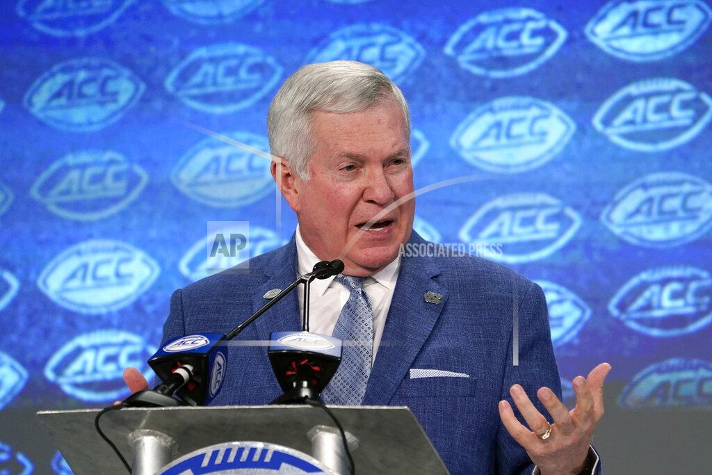 Chuck Burton FILE - In this July 18, 2019, file photo, North Carolina head coach Mack Brown speaks during the Atlantic Coast Conference NCAA college football media days in Charlotte, N.C. The coronavirus is preventing prospects from leaving home to visit campuses and is keeping college coaches from traveling to evaluate players across the country. Brown believes this could cause more 2021 prospects to stay home, though that point remains up for debate. A look at the 247Sports database shows that over 60 percent of verbally committed prospects who made their decisions on or before March 11 - the day the NBA suspended play to trigger the general shutdown of the sports world - chose schools within 300 miles of their hometowns. (AP Photo/Chuck Burton, FIle)