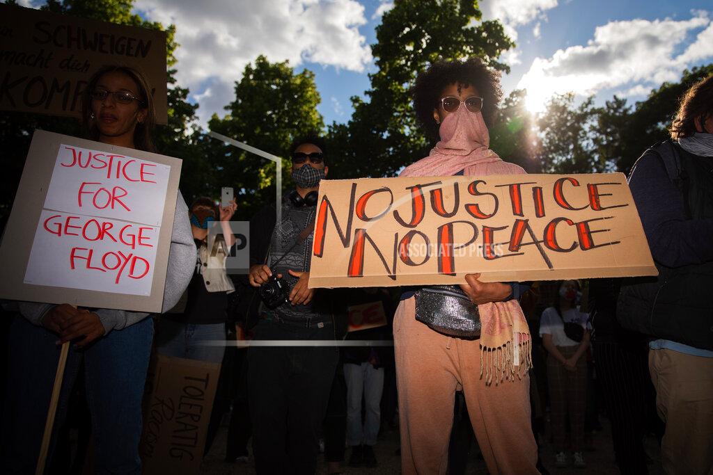 Christoph Soeder In this picture taken on Saturday, May 30, 2020 participants protest in a rally against the violent death of African-American George Floyd by a white policeman have gathered in front of the US embassy. After weeks of corona restrictions, there will no longer be a limited number of participants at demonstrations in Berlin starting this weekend. (Christoph Soeder/dpa via AP)