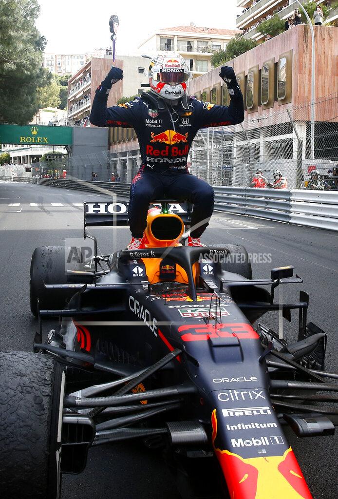 Sebastien Nogier Red Bull driver Max Verstappen of the Netherlands celebrates after winning the Monaco Grand Prix at the Monaco racetrack, in Monaco, Sunday, May 23, 2021. (Sebastien Nogier, Pool via AP)