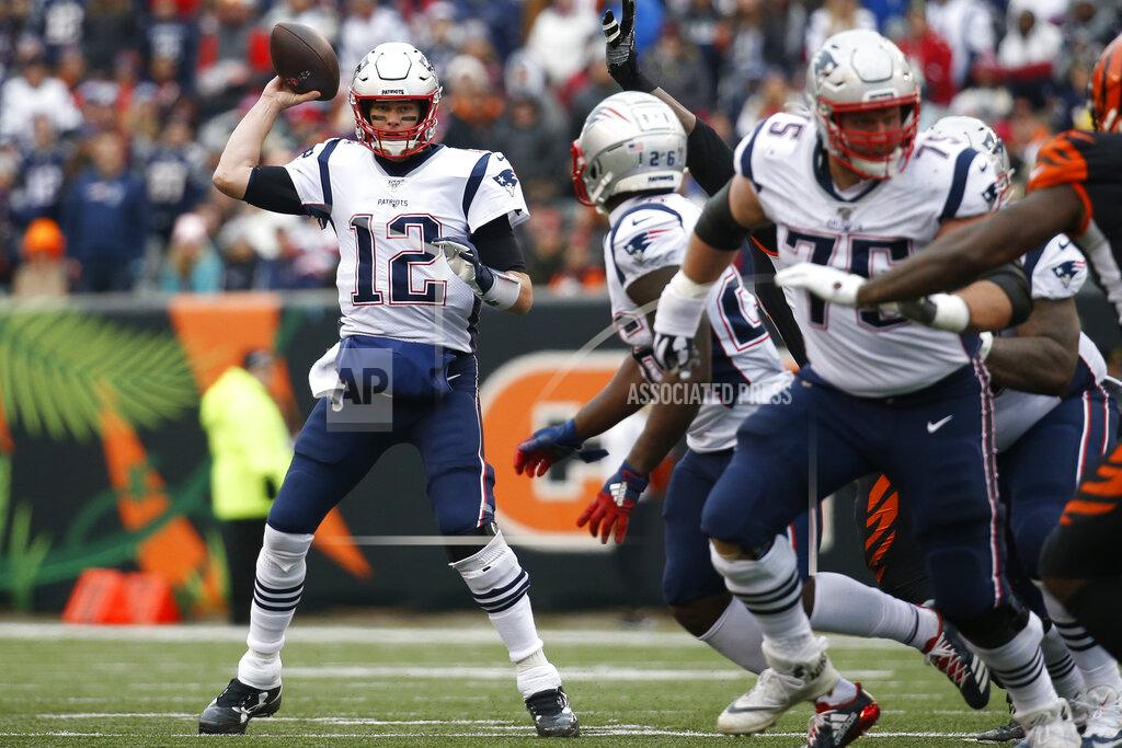 Frank Victores File-This Dec. 15, 2019, file photo shows New England Patriots quarterback Tom Brady (12) passing in the second half of an NFL football game against the Cincinnati Bengals, in Cincinnati. Members of a special panel of 26 selected all of them for the position as part of the NFL's celebration of its 100th season. All won league titles except Marino. All are in the Hall of Fame except Brady and Manning, who are not yet eligible. On Friday, Dec. 27, 2019, quarterback was the final position revealed for the All-Time Team. (AP Photo/Frank Victores, File)
