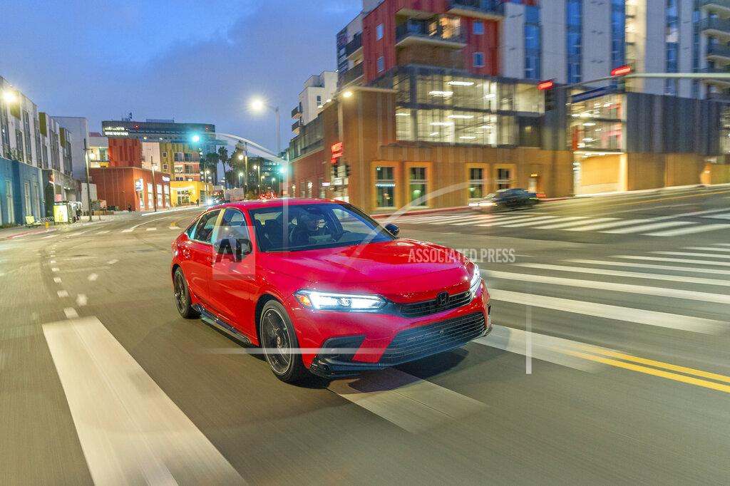 Uncredited This photo from Honda shows the redesigned Civic sedan. It has a new look plus a few more technology features than before. (American Honda Motor Co. via AP)