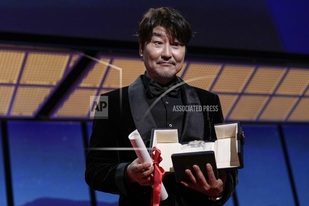 Joel C Ryan Song Kang-ho accepts the award for best actor for 'Broker' during the awards ceremony of the 75th international film festival, Cannes, southern France, Saturday, May 28, 2022. (Photo by Joel C Ryan/Invision/AP)