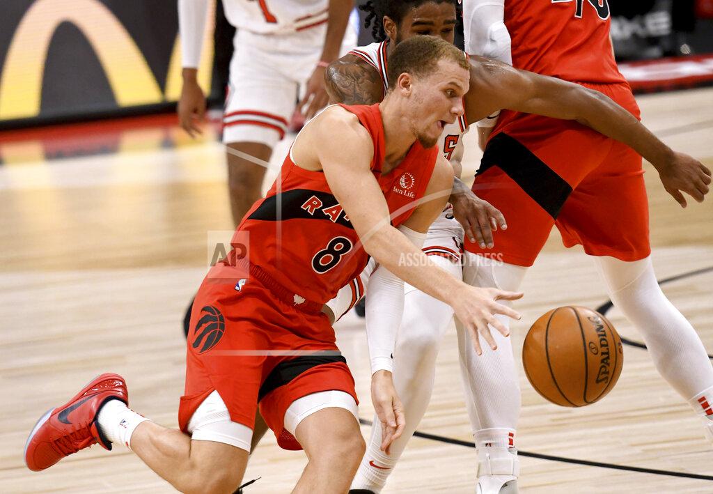 Jason Behnken Toronto Raptors guard Malachi Flynn (8) drives toward the basket against the Chicago Bulls during the first half of an NBA basketball game Thursday, April 8, 2021, in Tampa, Fla. (AP Photo/Jason Behnken)