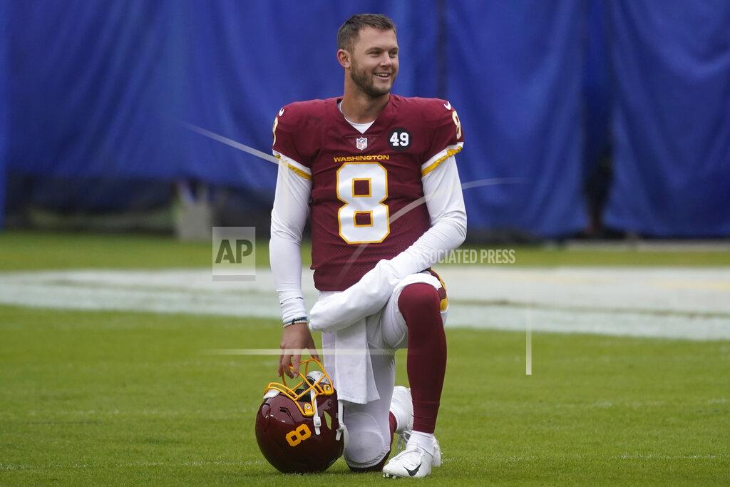 Al Drago Washington Football Team quarterback Kyle Allen (8) on the field before the start of the an NFL football game against the Dallas Cowboys, Sunday, Oct. 25, 2020, in Landover, Md. (AP Photo/Al Drago)