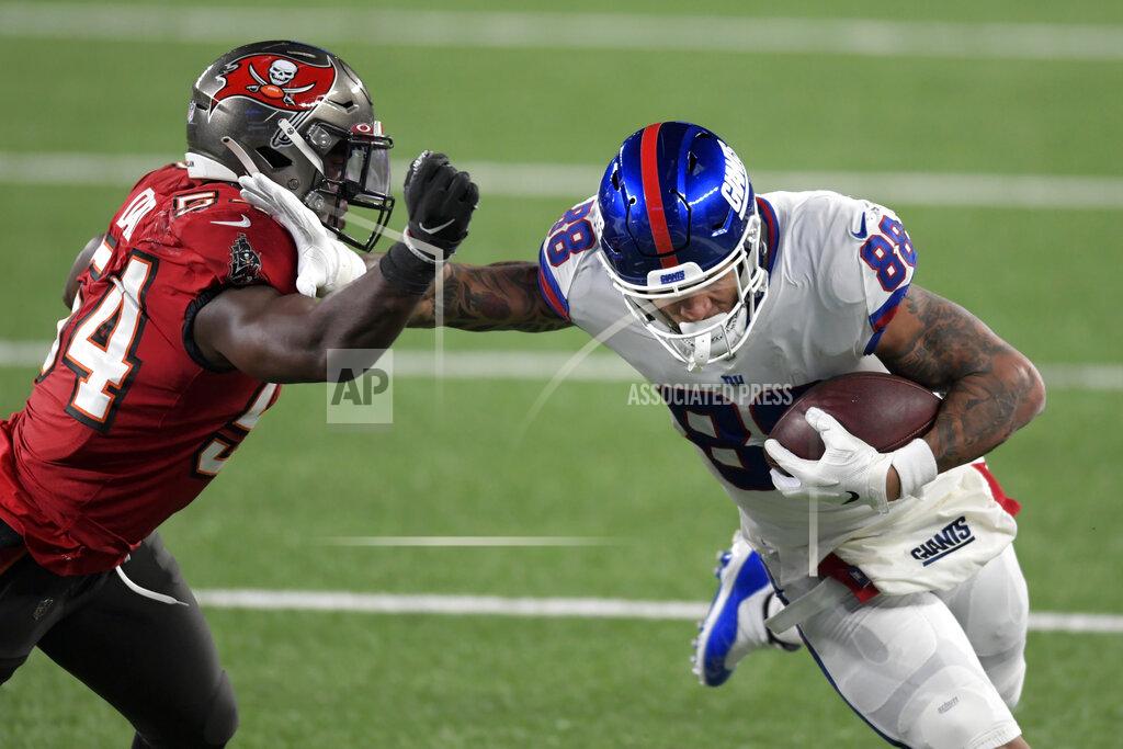 Bill Kostroun New York Giants' Evan Engram, right, fends off Tampa Bay Buccaneers' Lavonte David during the first half of an NFL football game, Monday, Nov. 2, 2020, in East Rutherford, N.J. (AP Photo/Bill Kostroun)
