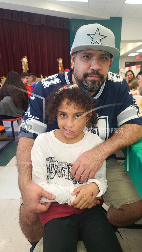 Uncredited In this image provided by Vincent Salazar, Layla Salazar and her father Vincent Salazar pose. Layla was one of the 19 children and their two teachers who were gunned down behind a barricaded door at Robb Elementary School in Uvalde, Texas. (Vincent Salazar via AP)