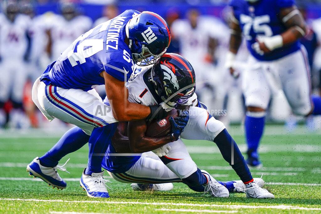 Matt Rourke New York Giants inside linebacker Blake Martinez (54) tackles Denver Broncos' K.J. Hamler (1) during the first half of an NFL football game Sunday, Sept. 12, 2021, in East Rutherford, N.J. (AP Photo/Matt Rourke)