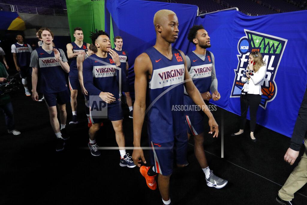 Charlie Neibergall Virginia players arrive for a practice session for the semifinals of the Final Four NCAA college basketball tournament, Friday, April 5, 2019, in Minneapolis. (AP Photo/Charlie Neibergall)