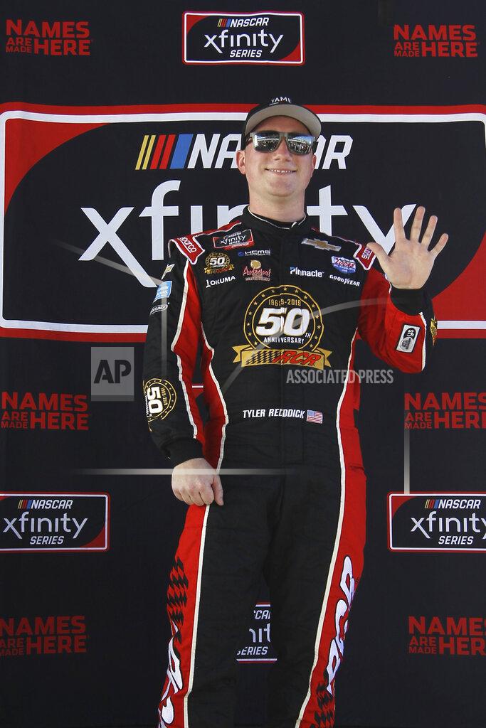 Luis M. Alvarez Tyler Reddick poses after winning the pole position for the NASCAR Xfinity Series auto racing championship at Homestead-Miami Speedway in Homestead, Fla. Saturday, Nov. 16, 2019. (AP Photo/Luis M. Alvarez)