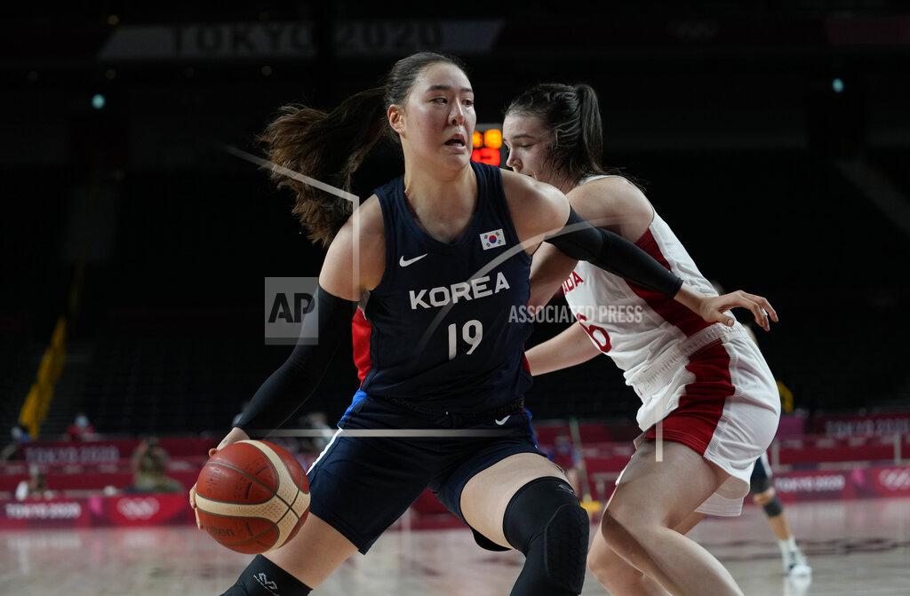 Eric Gay South Korea's Ji Su Park (19), front, drives around Canada's Bridget Carleton (6) during women's basketball preliminary round game at the 2020 Summer Olympics, Thursday, July 29, 2021, in Saitama, Japan. (AP Photo/Eric Gay)