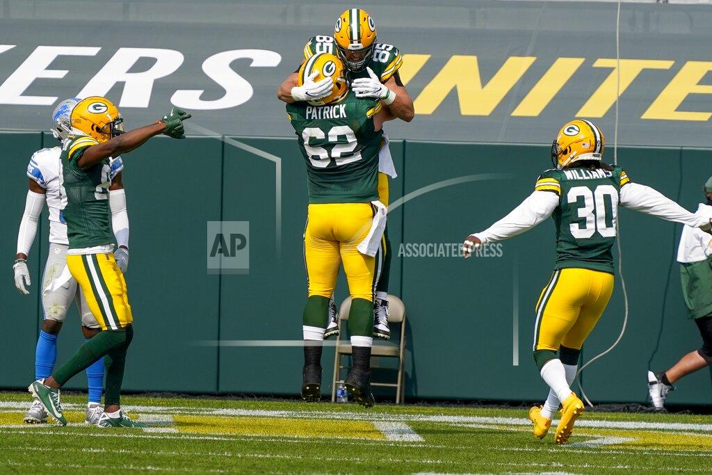 Morry Gash Green Bay Packers' Robert Tonyan is congratulated by Lucas Patrick (62) after catching a touchdown pass during the first half of an NFL football game against the Detroit Lions Sunday, Sept. 20, 2020, in Green Bay, Wis. (AP Photo/Morry Gash)