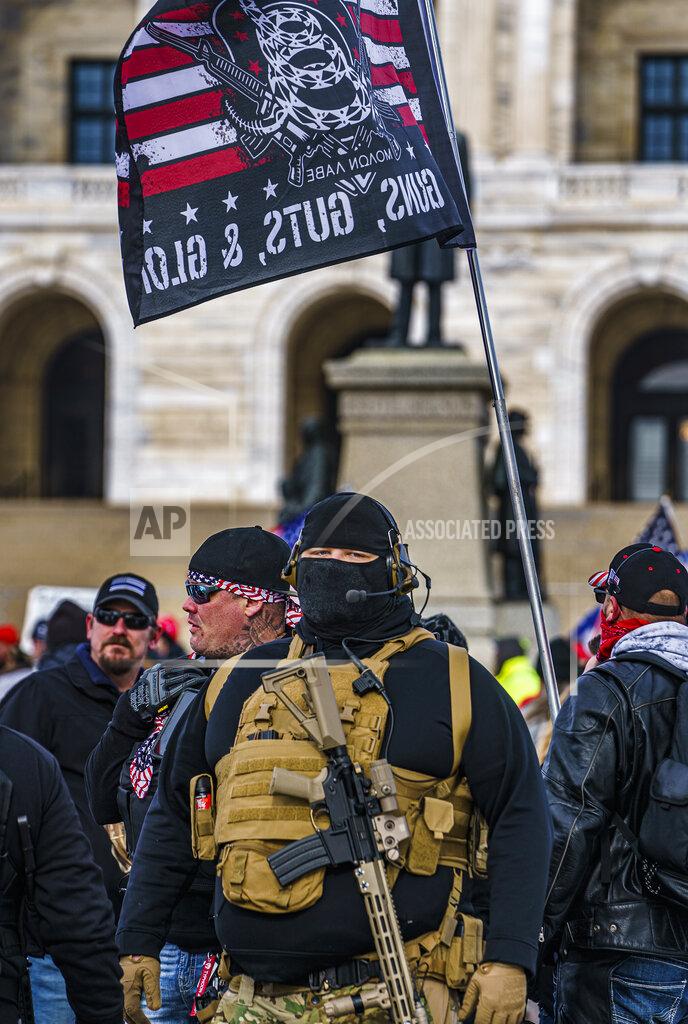 Protesters attended a rally in support of President Donald Trump on the steps of the Minnesota State Capitol on Wednesday, Jan. 6, 2021 in St. Paul, Minn. (Richard Tsong-Taatarii/Star Tribune via AP)