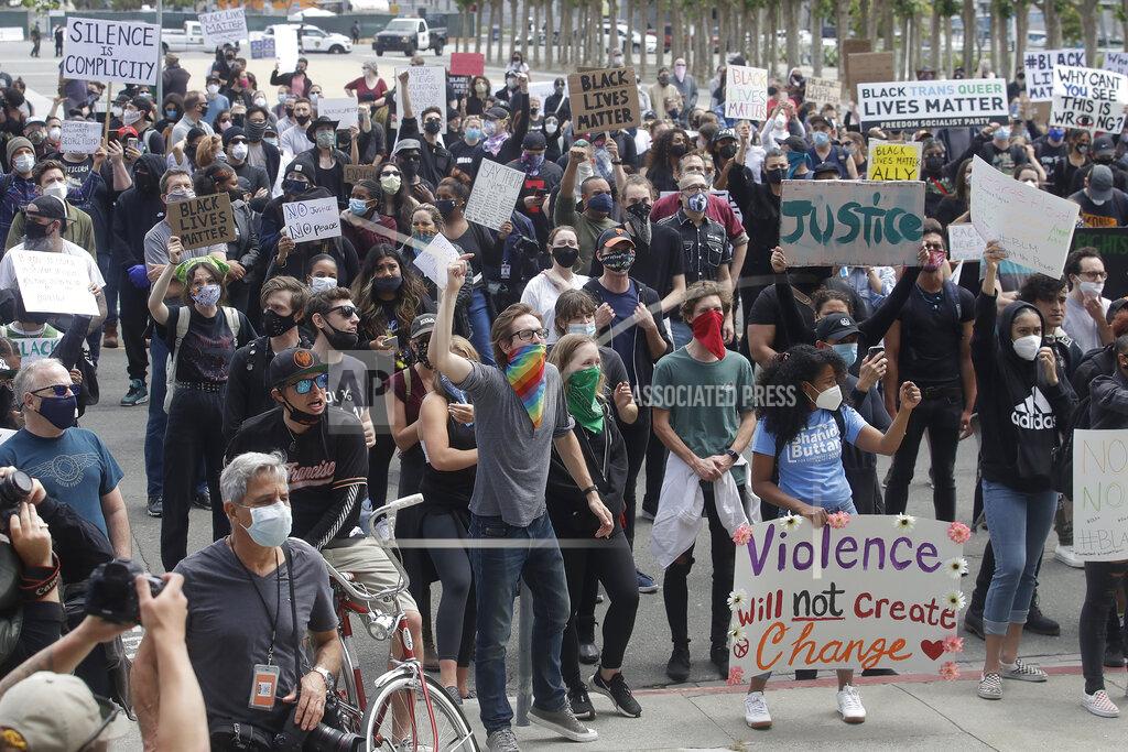 Jeff Chiu People listen to speakers at a protest over the Memorial Day death of George Floyd, a handcuffed black man in police custody in Minneapolis, in San Francisco, Saturday, May 30, 2020. (AP Photo/Jeff Chiu)