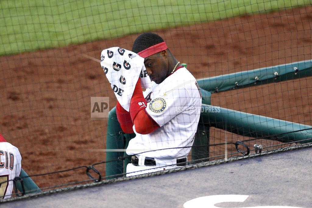 Nick Wass Washington Nationals' Victor Robles wipes his face at the dugout during the third inning of a baseball game against the Toronto Blue Jays, Monday, July 27, 2020, in Washington. (AP Photo/Nick Wass)