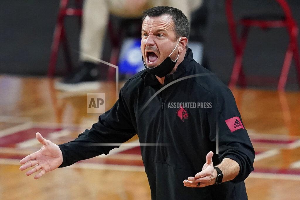 Elise Amendola Louisville head coach Jeff Walz instructs his team in the first half of an NCAA college basketball game against Boston College, Thursday, Feb. 4, 2021, in Boston. (AP Photo/Elise Amendola)