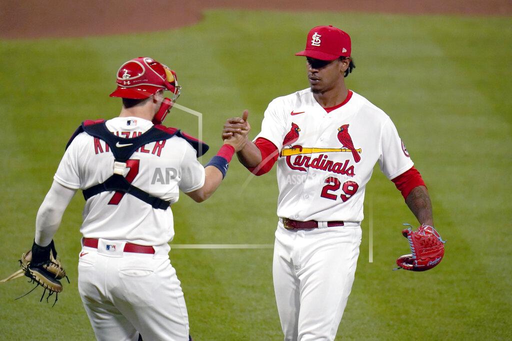 Jeff Roberson St. Louis Cardinals relief pitcher Alex Reyes (29) and catcher Andrew Knizner celebrate a 5-4 victory over the Cincinnati Reds in a baseball game Friday, April 23, 2021, in St. Louis. (AP Photo/Jeff Roberson)