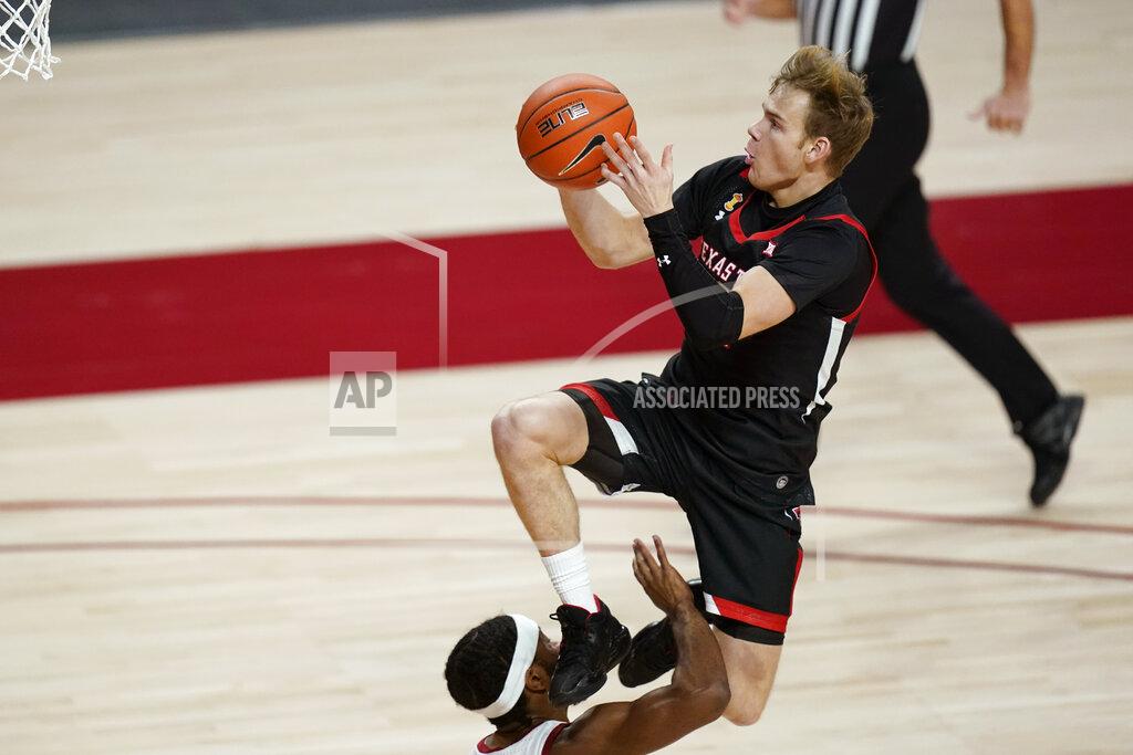 Charlie Neibergall Texas Tech guard Mac McClung, top, is fouled by Iowa State guard Tre Jackson while driving to the basket during the first half of an NCAA college basketball game, Saturday, Jan. 9, 2021, in Ames, Iowa. (AP Photo/Charlie Neibergall)
