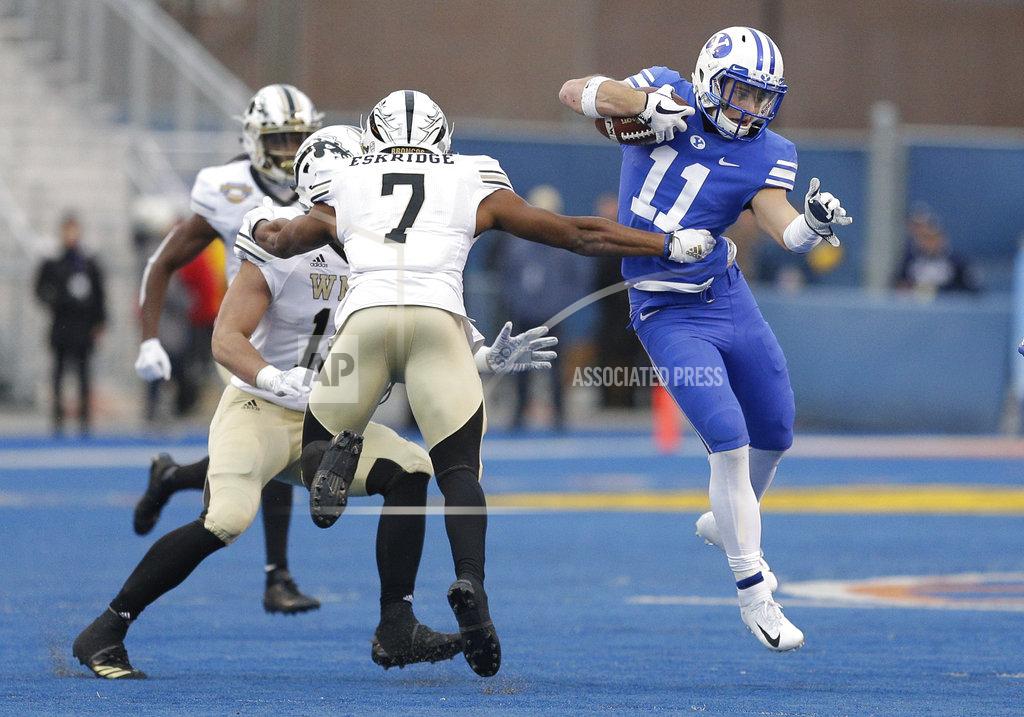 Steve Conner BYU defensive back Austin Lee (11) tries to get past Western Michigan linebacker Najee Clayton (7) during an interception return in the second half of the Famous Idaho Potato Bowl NCAA college football game, Friday, Dec. 21, 2018, in Boise, Idaho. (AP Photo/Steve Conner)
