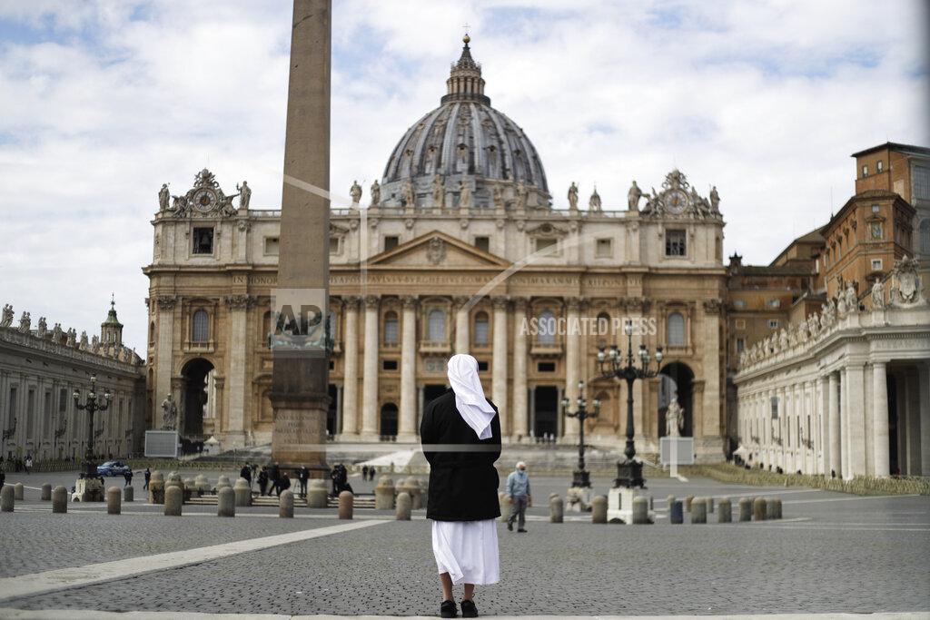 Gregorio Borgia FILE - In this Sunday, March 21, 2021 filer, a nun stands in St. Peter's Square at the Vatican. Vatican prosecutors have alleged a jaw-dropping series of scandals in launching the biggest criminal trial in the Vatican’s modern history, which opens Tuesday in a modified courtroom in the Vatican Museums. The once-powerful cardinal and nine other people are accused of bleeding the Holy See of tens of millions of dollars in donations through bad investments, deals with shady money managers and apparent favors to friends and family. (AP Photo/Gregorio Borgia, File)
