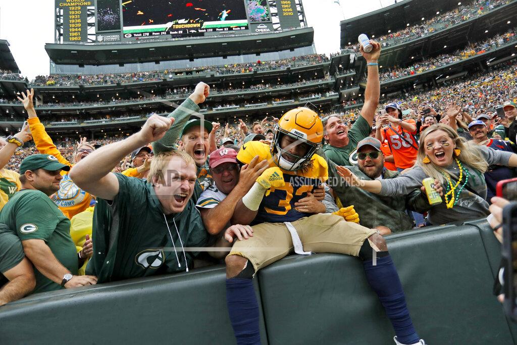 Matt Ludtke Green Bay Packers running back Aaron Jones is congratulated by fans after scoring during the first half of an NFL football game against the Denver Broncos, Sunday, Sept. 22, 2019, in Green Bay, Wis. (AP Photo/Matt Ludtke)