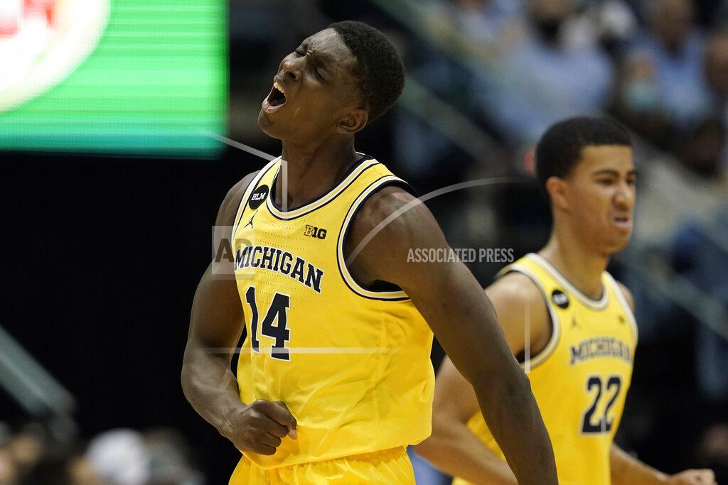 Gerry Broome Michigan forward Moussa Diabate (14) teacts during the first half of an NCAA college basketball game against North Carolina in Chapel Hill, N.C., Wednesday, Dec. 1, 2021. (AP Photo/Gerry Broome)