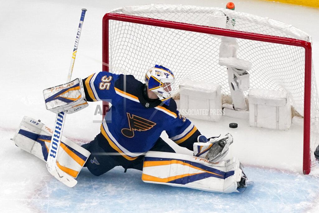 Jeff Roberson St. Louis Blues goaltender Ville Husso watches as a puck shot by Colorado Avalanche's Nazem Kadri slips past for a goal during the second period in Game 4 of an NHL hockey Stanley Cup second-round playoff series Monday, May 23, 2022, in St. Louis. (AP Photo/Jeff Roberson)