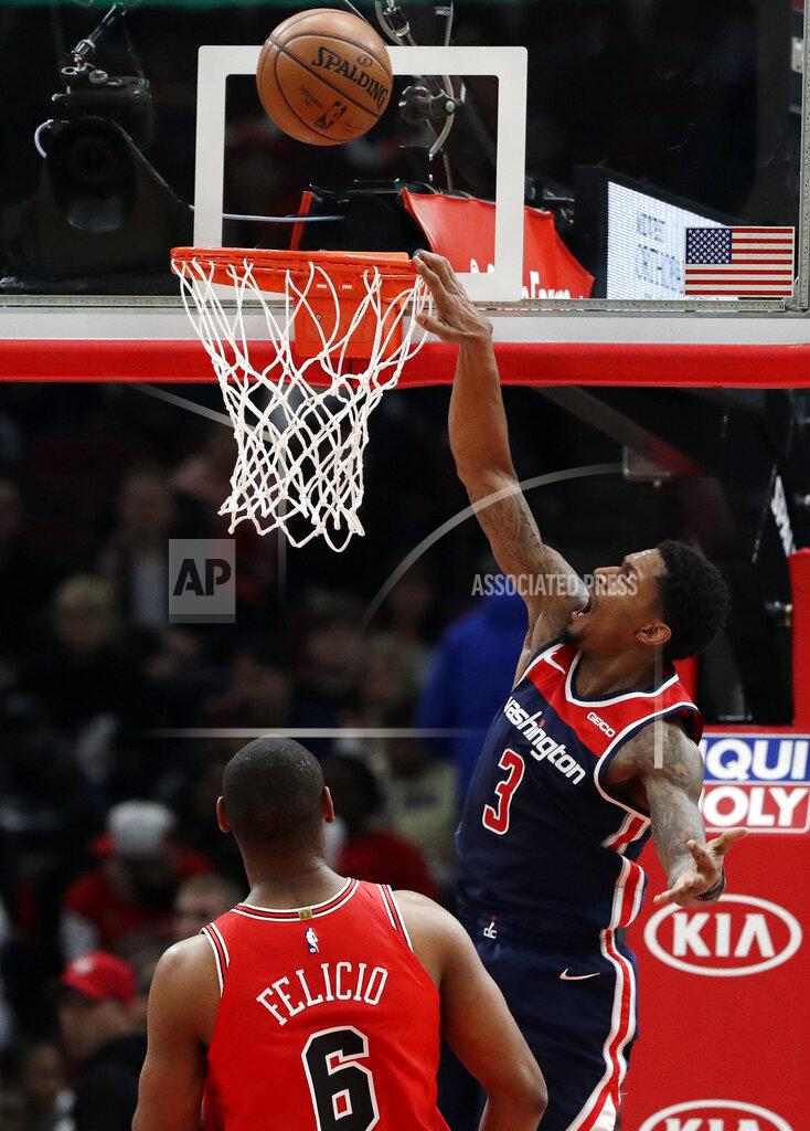 Nam Y. Huh Washington Wizards guard Bradley Beal, right, reacts after missing a dunk against the Chicago Bulls during overtime of an NBA basketball game Wednesday, March 20, 2019, in Chicago. The Bulls won 126-120. (AP Photo/Nam Y. Huh)