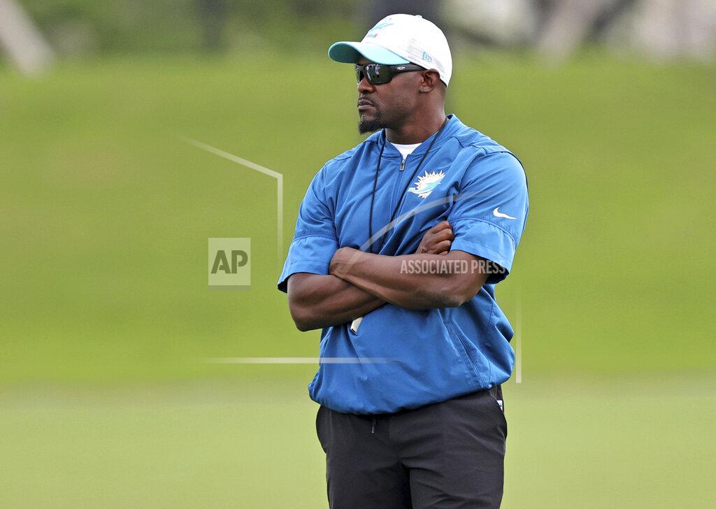 Miami Dolphins head coach Brian Flores looks on during practice at Baptist Health Training Complex in Hard Rock Stadium on Thursday, October 7, 2021 in Miami Gardens, Florida, in preparation for their game against the Tampa Bay Buccaneers at Raymond James Stadium, on Sunday, October 10.(David Santiago/Miami Herald via AP)
