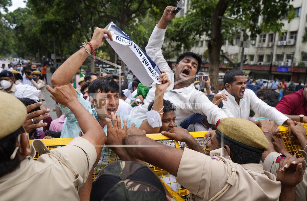 Manish Swarup Indian Youth Congress members try to breach a police barricade during a protest held to mark Indian Prime Minister Narendra Modi's birthday in New Delhi, India, Friday, Sept.17, 2021. Youth members of main opposition Congress party clashed with police during a street protest Friday demanding jobs as the country’s economy recovered from the impact of the COVID-19 pandemic that triggered massive unemployment in the country. The march took place as supporters of Prime Minister Narendra Modi celebrated his birthday as he turned 71 on Friday. (AP Photo/Manish Swarup)